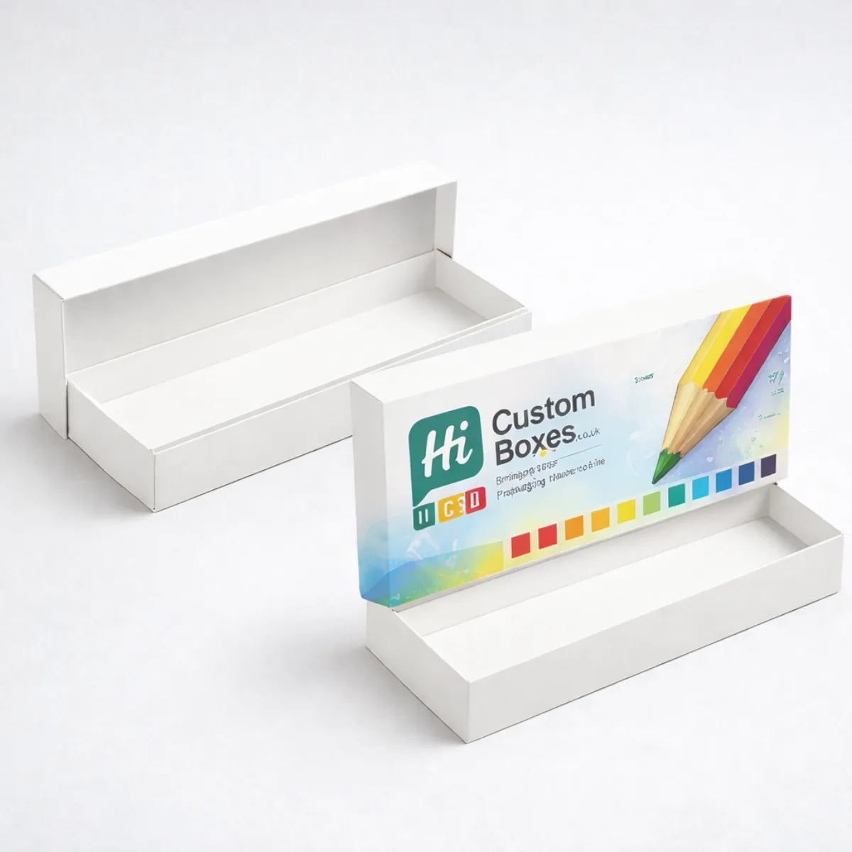 Two long, premium horizontal pencil boxes with lids; one is plain white and the other features a large pencil illustration. class=